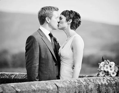 documentary wedding photography of couple on the bridge at burnsall